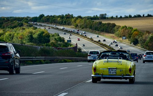 Cars driving on a toll road in the Czech Republic with yellow road markings